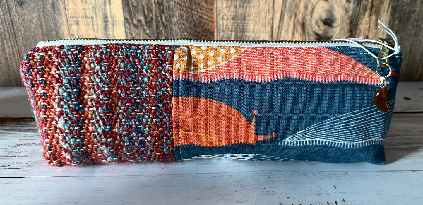 Slug Parade with Handwoven Wool Long and Lean Zipper Bag