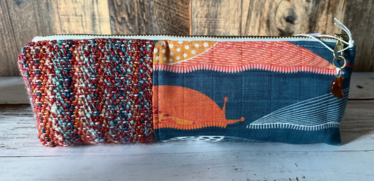 Slug Parade with Handwoven Wool Long and Lean Zipper Bag