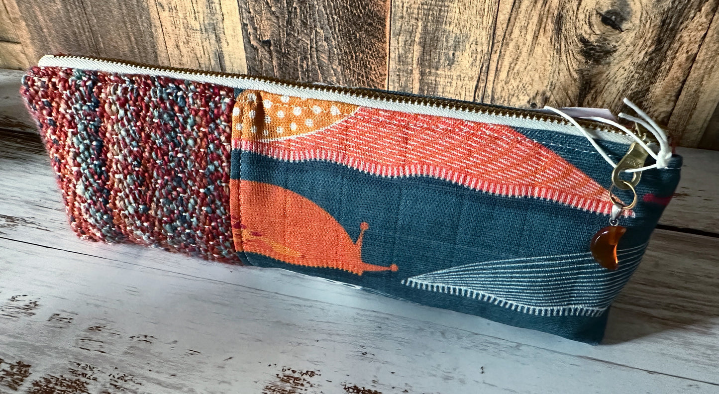 Slug Parade with Handwoven Wool Long and Lean Zipper Bag