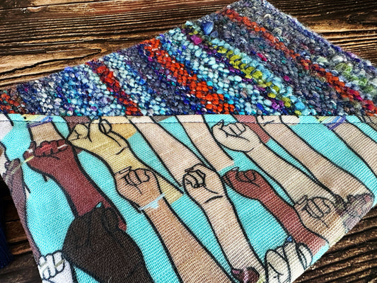 Resist Fists with Handwoven Wool Zipper Bag