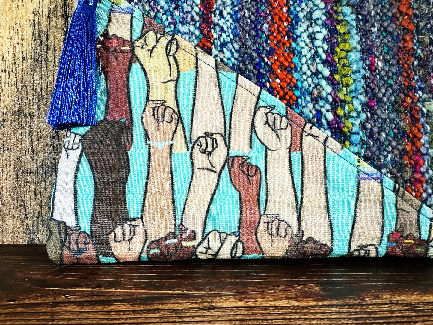 Resist Fists with Handwoven Wool Zipper Bag