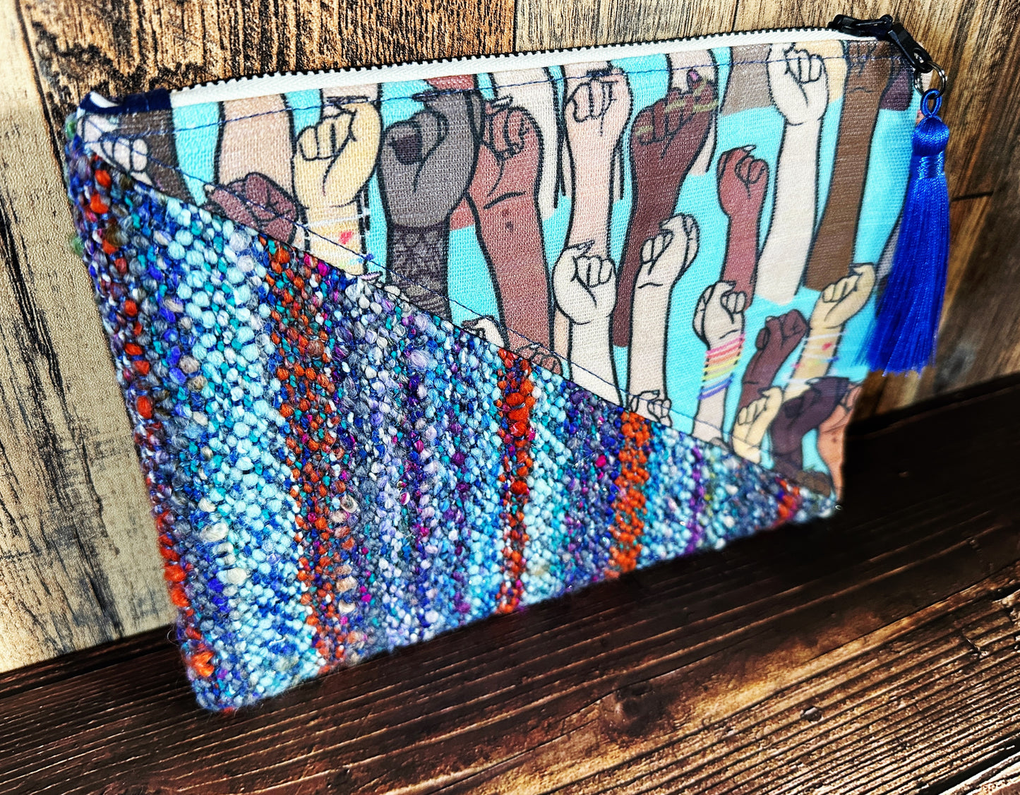 Resist Fists with Handwoven Wool Zipper Bag